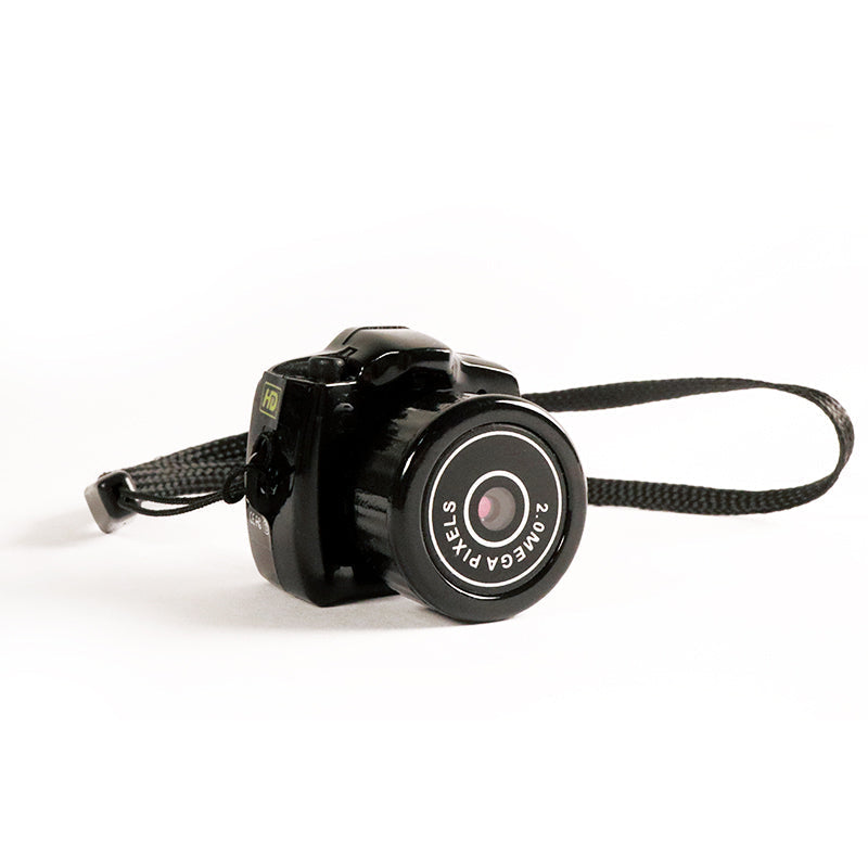 "Compacte HD mini videocamera, draagbaar ontwerp met schokbestendige behuizing, ideaal voor scherpe 1080HD opnamen."