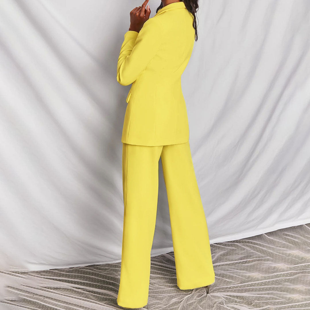"Dames blazer en broek set, geel, elegante snit, moderne flair, geschikt voor formele en casual gelegenheden."
