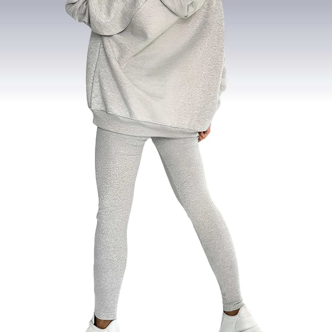 "Driedelige sportset dames met elegante top, sportbeha en legging; ademende en elastische stoffen voor comfort en stijl."