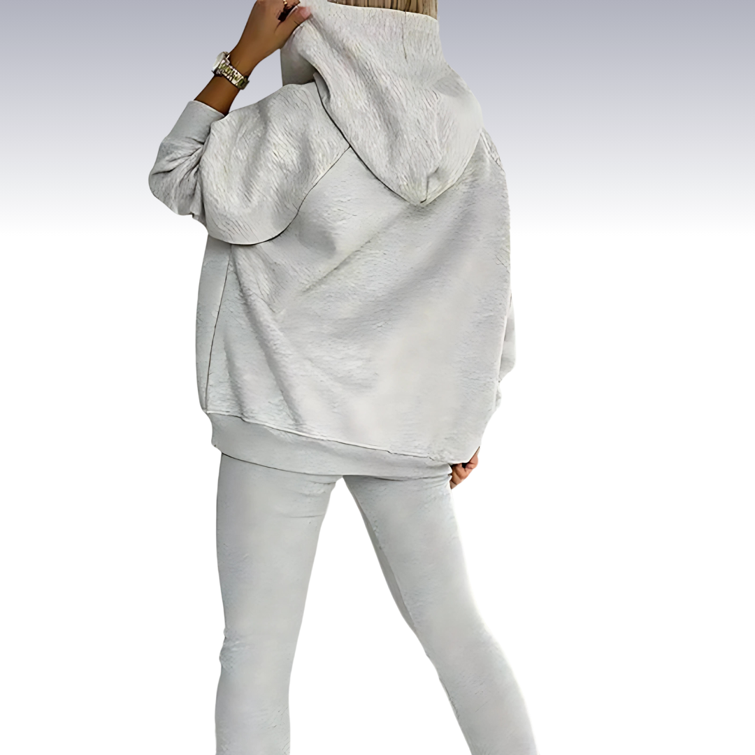 "Driedelige sportset dames met elegante top, sportbeha en legging; ademende en elastische stoffen voor comfort en stijl."