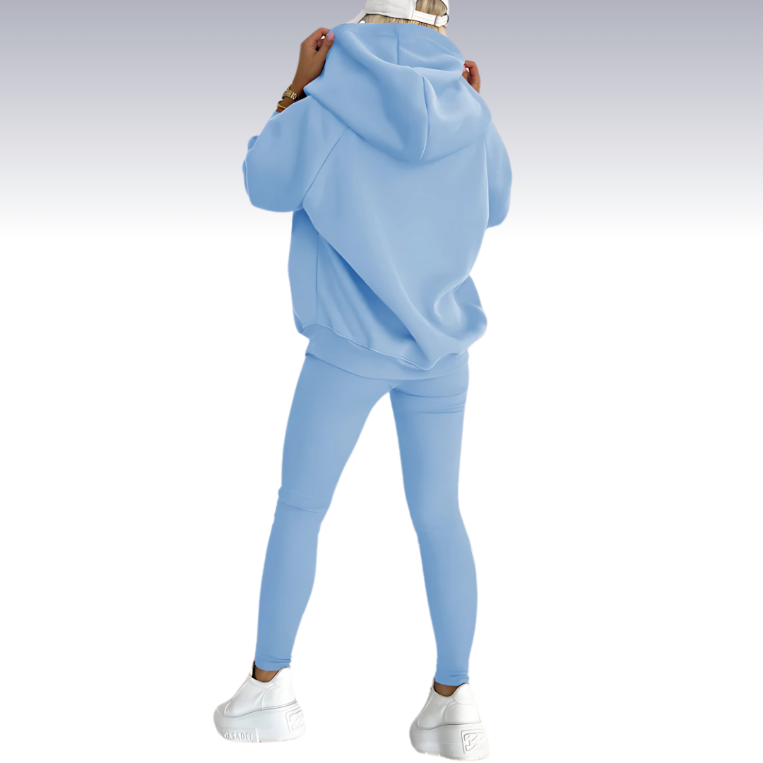 "Driedelige sportset dames met elegante top, sportbeha en legging; ademende en elastische stoffen voor comfort en stijl."