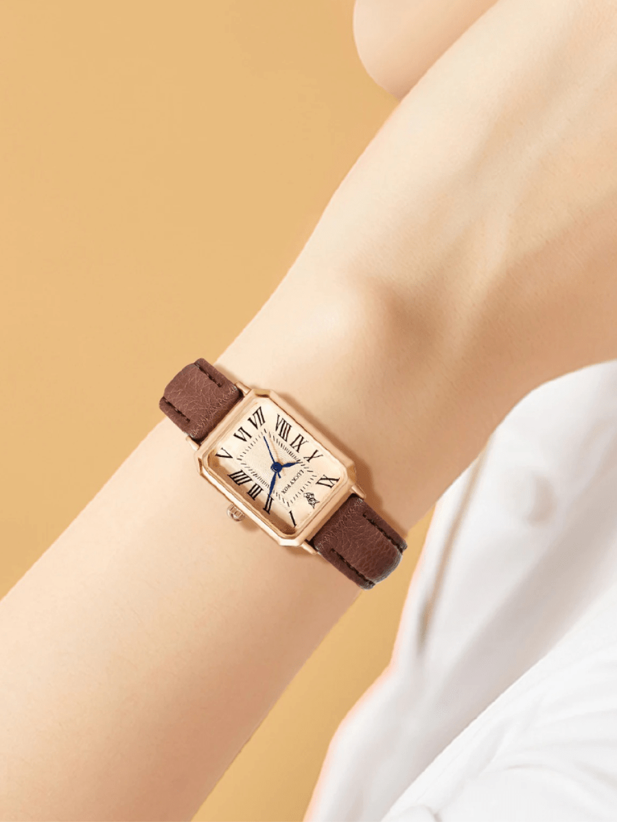 Elegant retro dameshorloge met vierkante gouden kast en bruine leren band, perfecte balans tussen stijl en comfort.