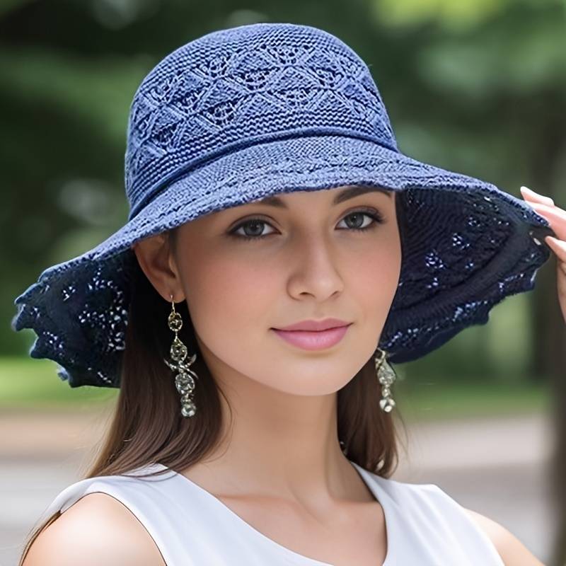 Elegante breedgerande zonnehoed voor reizen, opvouwbaar design, biedt zonbescherming, verkrijgbaar in chic marineblauw.