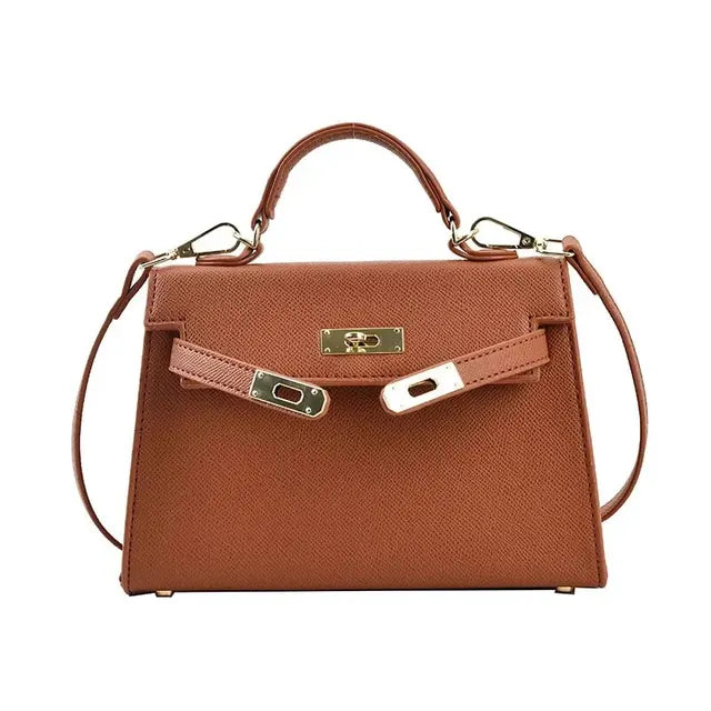 "Elegante dames schoudertas van leer, verkrijgbaar in beige, bruin, wit, en zwart, klassieke en stijlvolle uitstraling."