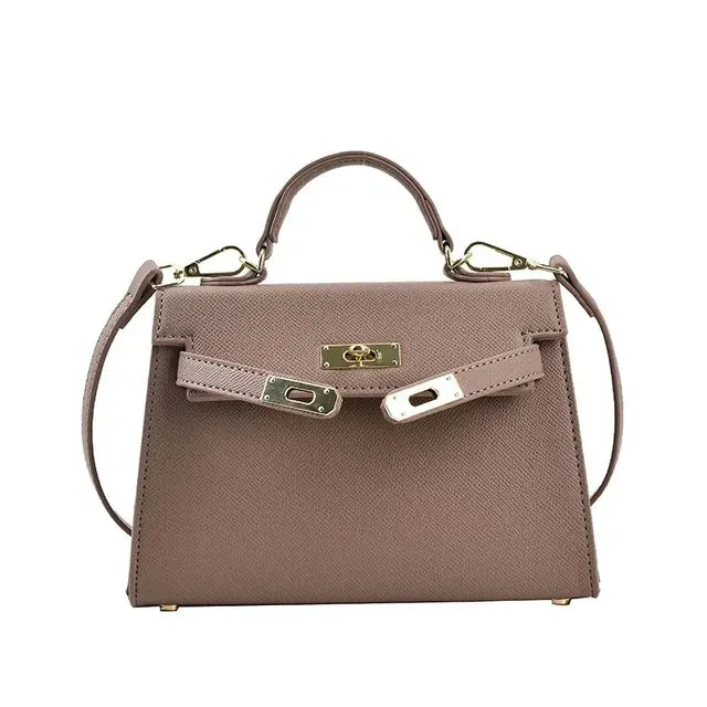 "Elegante dames schoudertas van leer, verkrijgbaar in beige, bruin, wit, en zwart, klassieke en stijlvolle uitstraling."