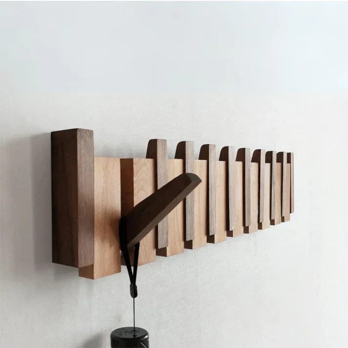 "Elegante houten kapstok met uniek pianotoetsdesign, walnoot- en beukenhout, ruimtebesparend met meerdere haken."