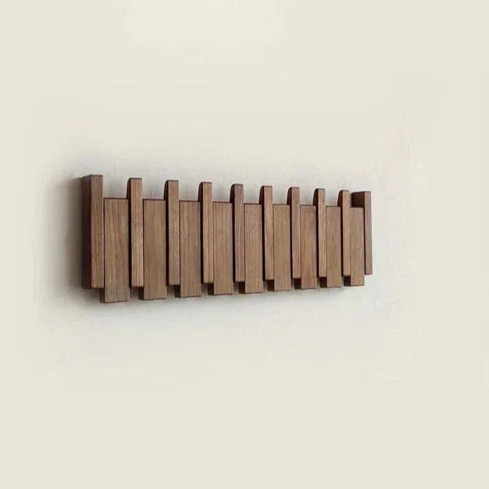 "Elegante houten kapstok met uniek pianotoetsdesign, walnoot- en beukenhout, ruimtebesparend met meerdere haken."