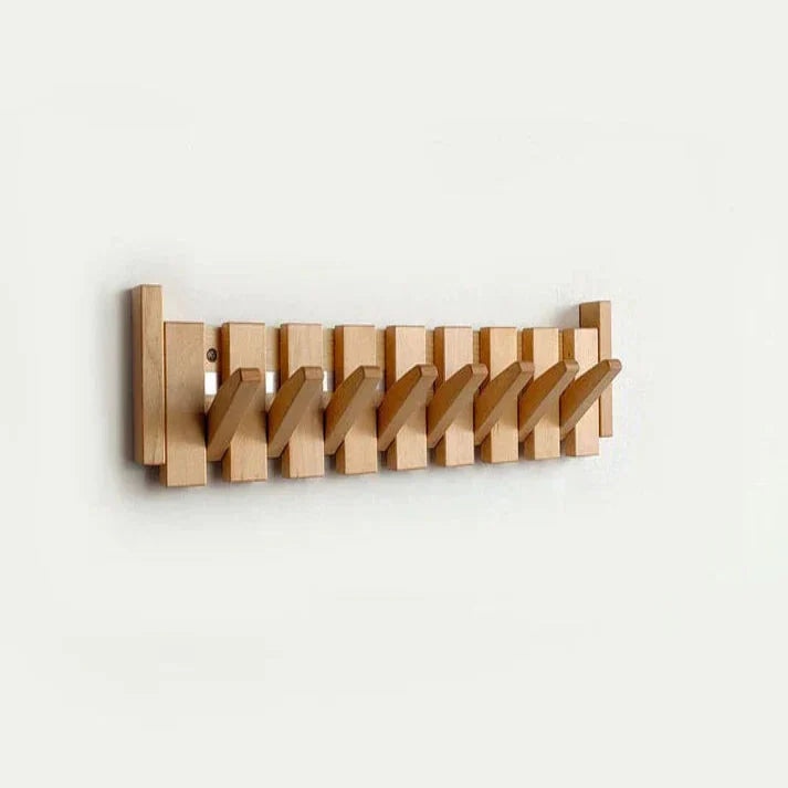 "Elegante houten kapstok met uniek pianotoetsdesign, walnoot- en beukenhout, ruimtebesparend met meerdere haken."
