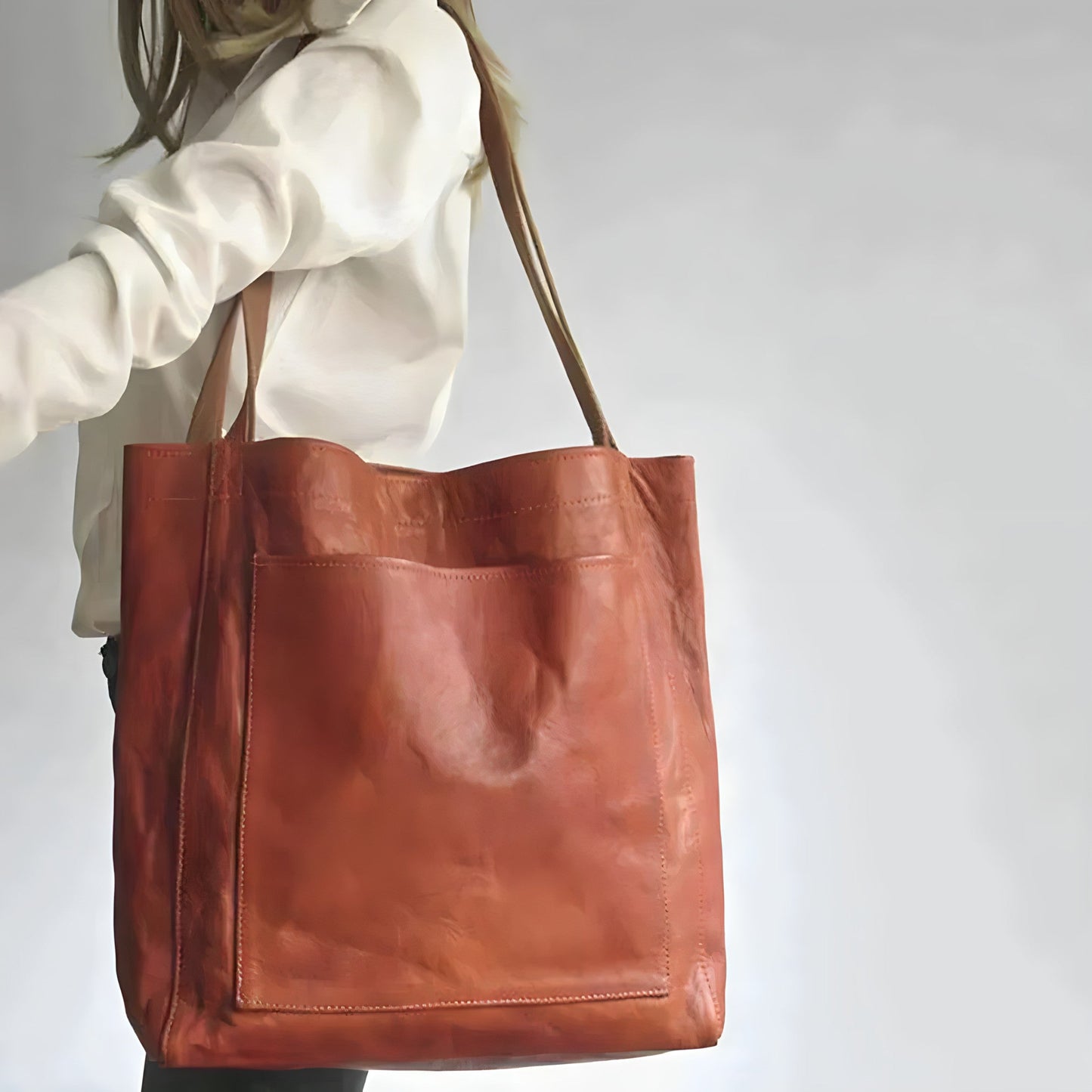 "Elegante leren damestas met ruime opbergruimte en veilige sluiting, ideaal voor moderne vrouwen, verkrijgbaar in diverse kle
