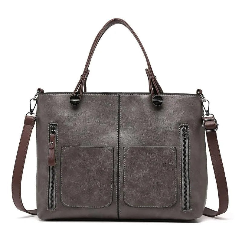 "Elegante leren schoudertas met magnetische sluiting, duurzaam bruin leer, verstelbare riem voor draagcomfort."