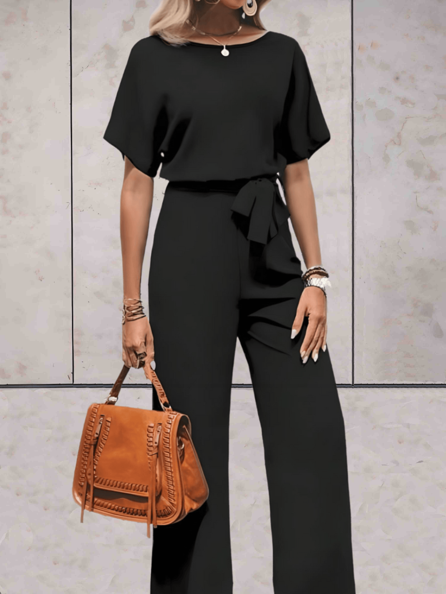 "Elegante Noa jumpsuit voor dames met wijde mouwen en striklinten, comfortabele luchtige stof, ideaal voor elke gelegenheid."