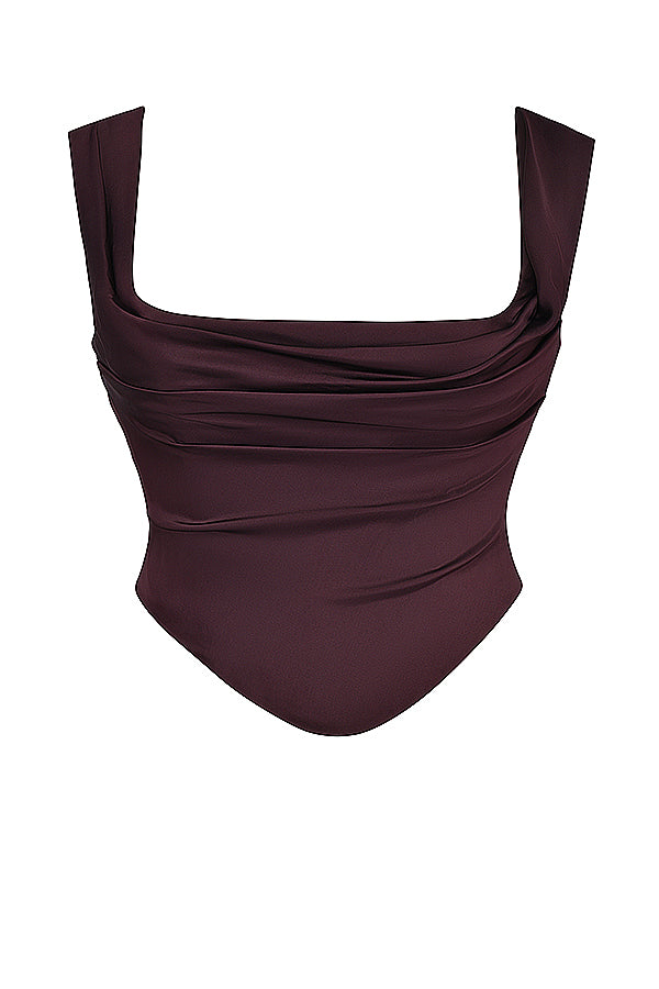 "Elegante satijnen Odette set met corset-top en maxirok, luxe diepe tinten voor stijlvolle vrouwelijke uitstraling."