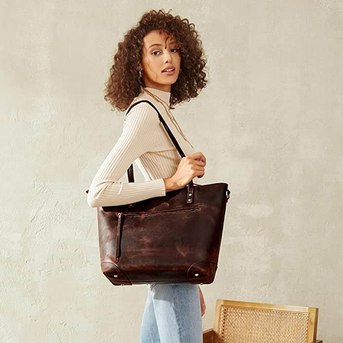 "Elegante vintage leren draagtas van PU-leer met verstelbare schouderriem, ruim interieur en meerdere vakken."
