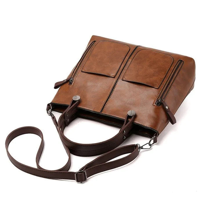"Elegante vintage leren schoudertas voor dames met verfijnde stiksels en ruime opbergvakken, ideaal voor dagelijks gebruik."