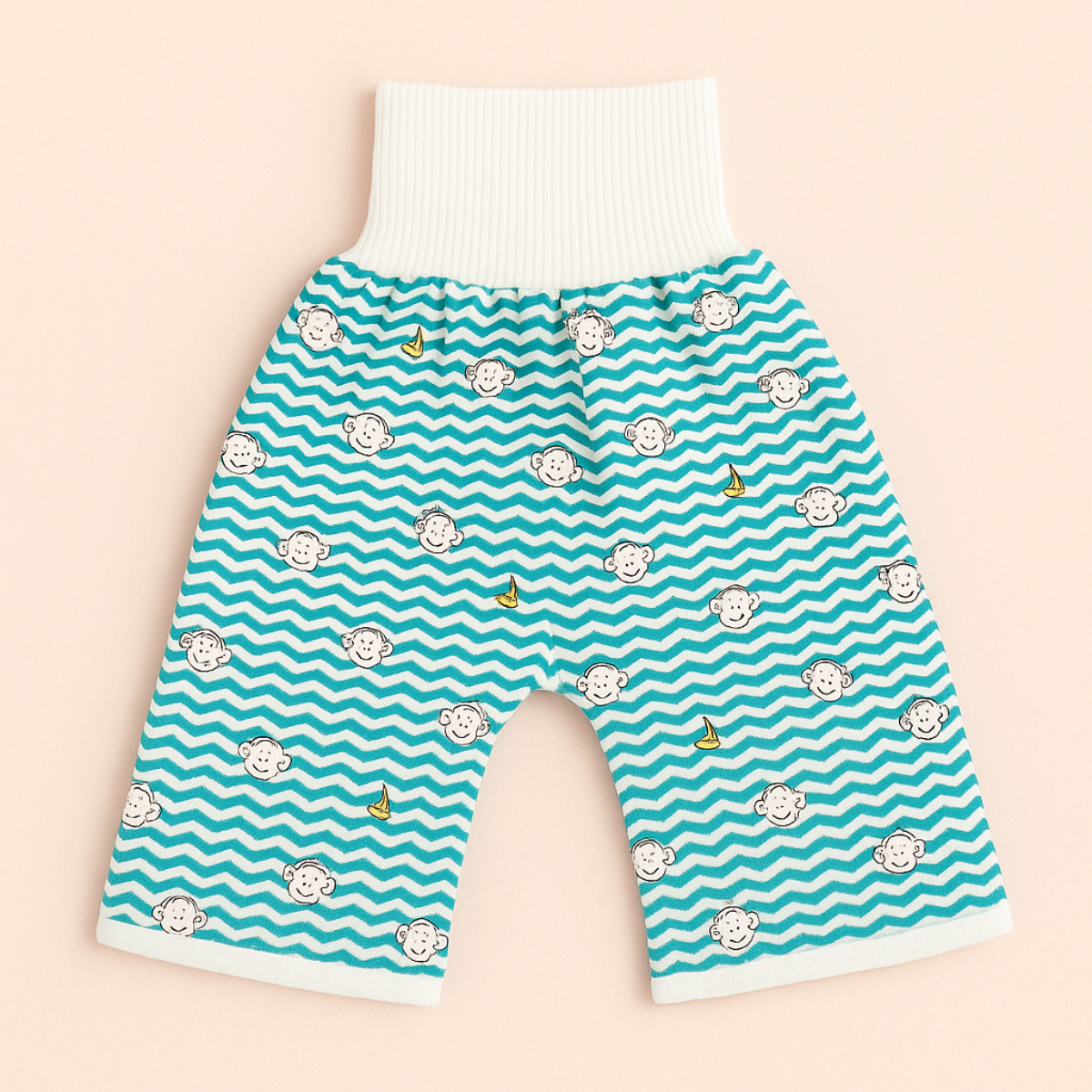 "Herbruikbare baby training pants, comfortabel en milieuvriendelijk, met schattige blauwe beertjes en roze hondjes patroon."