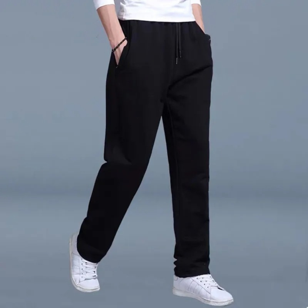 "Lichte heren joggingbroek, katoen, comfortabele pasvorm, elastische taille, moderne wijde pijpen, minimalistische stijl."