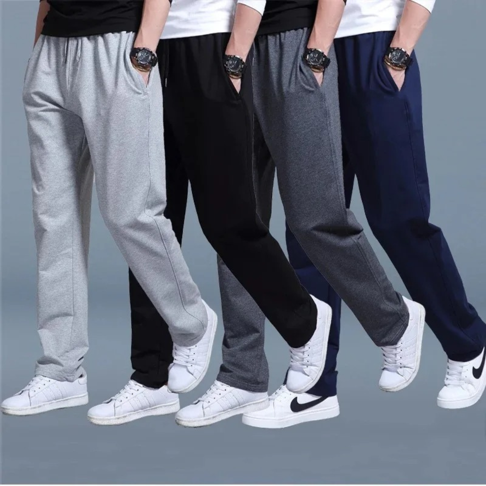 "Lichte heren joggingbroek, katoen, comfortabele pasvorm, elastische taille, moderne wijde pijpen, minimalistische stijl."