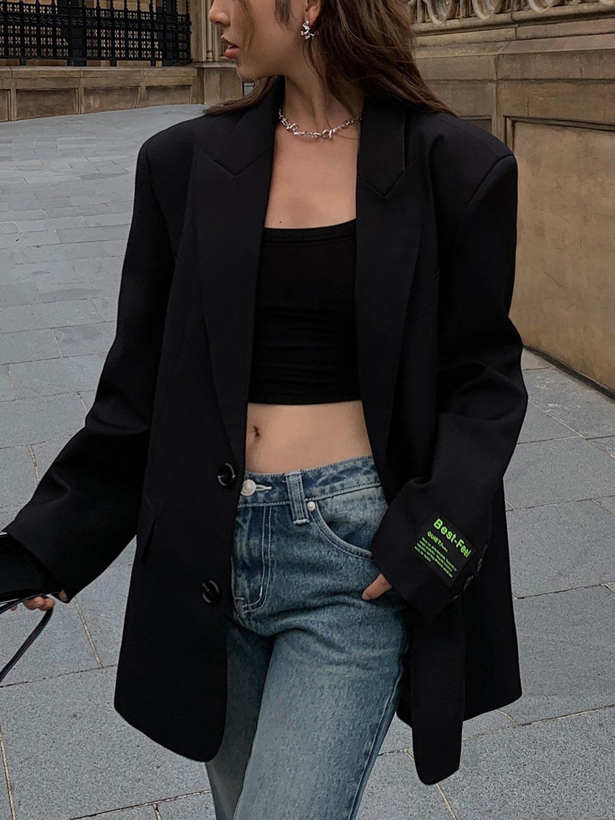 "Lorène oversized klassieke blazer, elegante grijze jas met revers en gedrapeerde pasvorm, voor moderne en chique outfits."