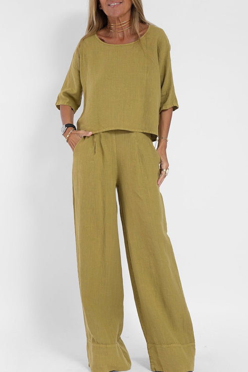 Luchtig katoen-linnen pak voor dames met een cropped shirt en wijde broek, perfect voor een stijlvolle zomerse look.