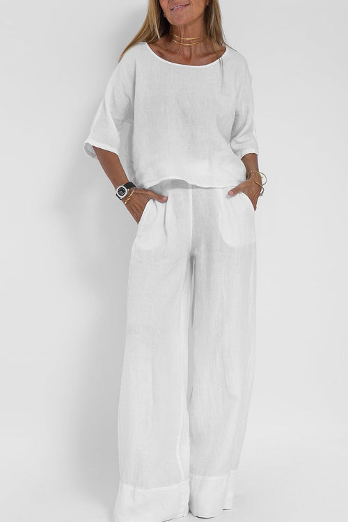 Luchtig katoen-linnen pak voor dames met een cropped shirt en wijde broek, perfect voor een stijlvolle zomerse look.