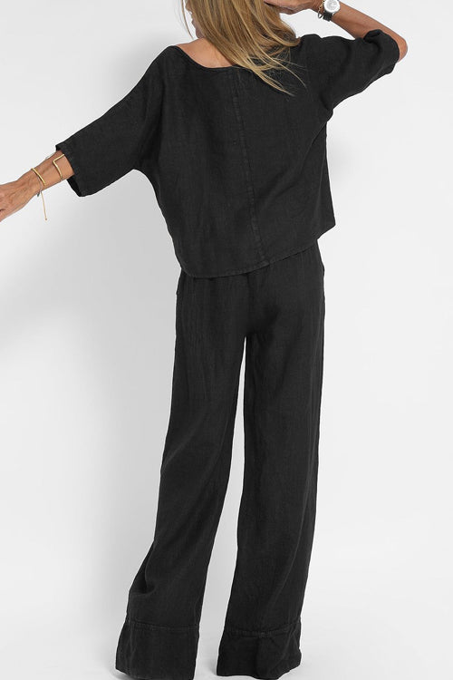 Luchtig katoen-linnen pak voor dames met een cropped shirt en wijde broek, perfect voor een stijlvolle zomerse look.