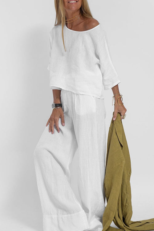Luchtig katoen-linnen pak voor dames met een cropped shirt en wijde broek, perfect voor een stijlvolle zomerse look.