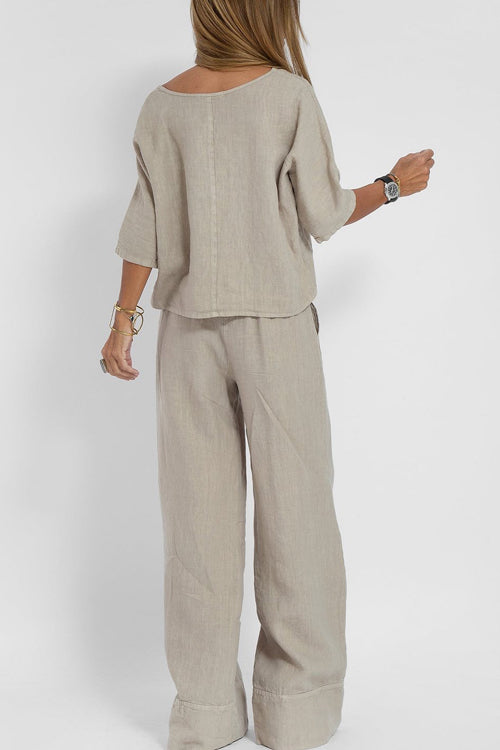Luchtig katoen-linnen pak voor dames met een cropped shirt en wijde broek, perfect voor een stijlvolle zomerse look.