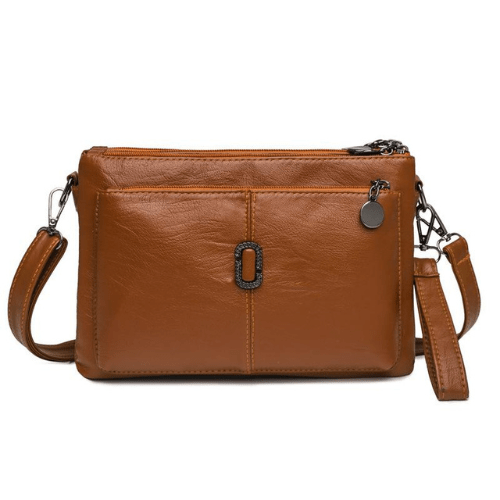 Luxe leren schoudertas voor dames, elegant design met ruime compartimenten en hoogwaardige afwerking, in diverse kleuren.