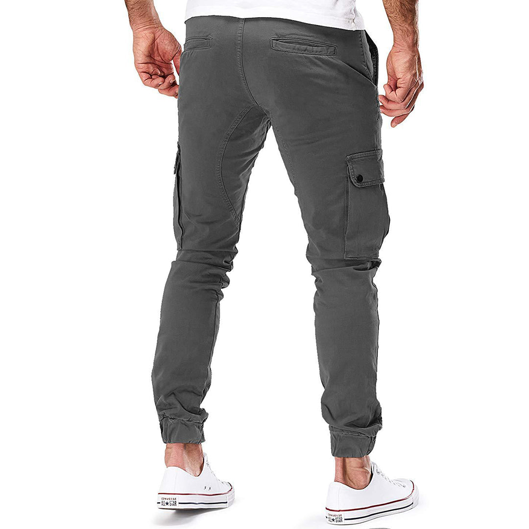 "Moderne heren cargo broek met elastische taille, ruime zakken en trendy ontwerp voor comfort en stijl."