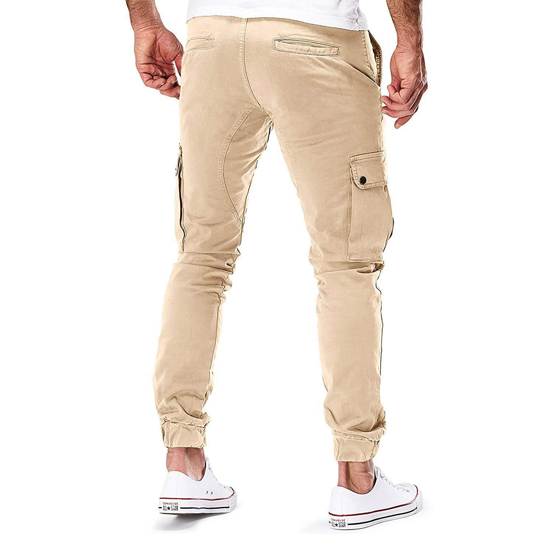 "Moderne heren cargo broek met elastische taille, ruime zakken en trendy ontwerp voor comfort en stijl."