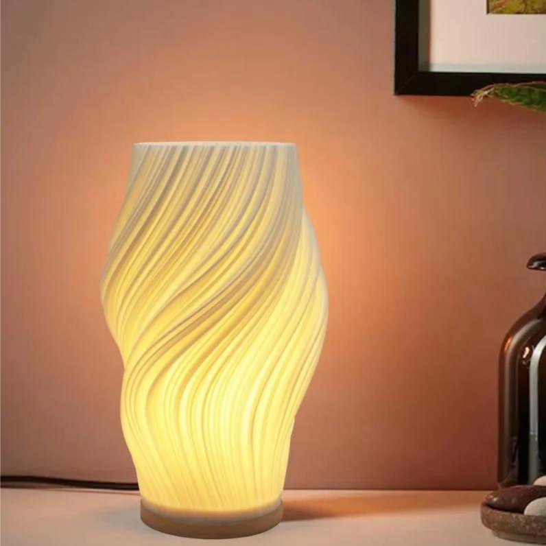 "Moderne LED tafellamp met uniek swirl design, zachte warme gloed. Perfect voor bureau, nachtkastje of boekenplank."