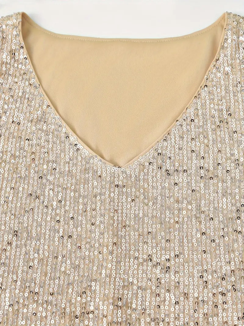 "Mouwloze top met V-hals, pailletten, elegante uitstraling, lichte stof; perfect voor zomer en avondjes uit."