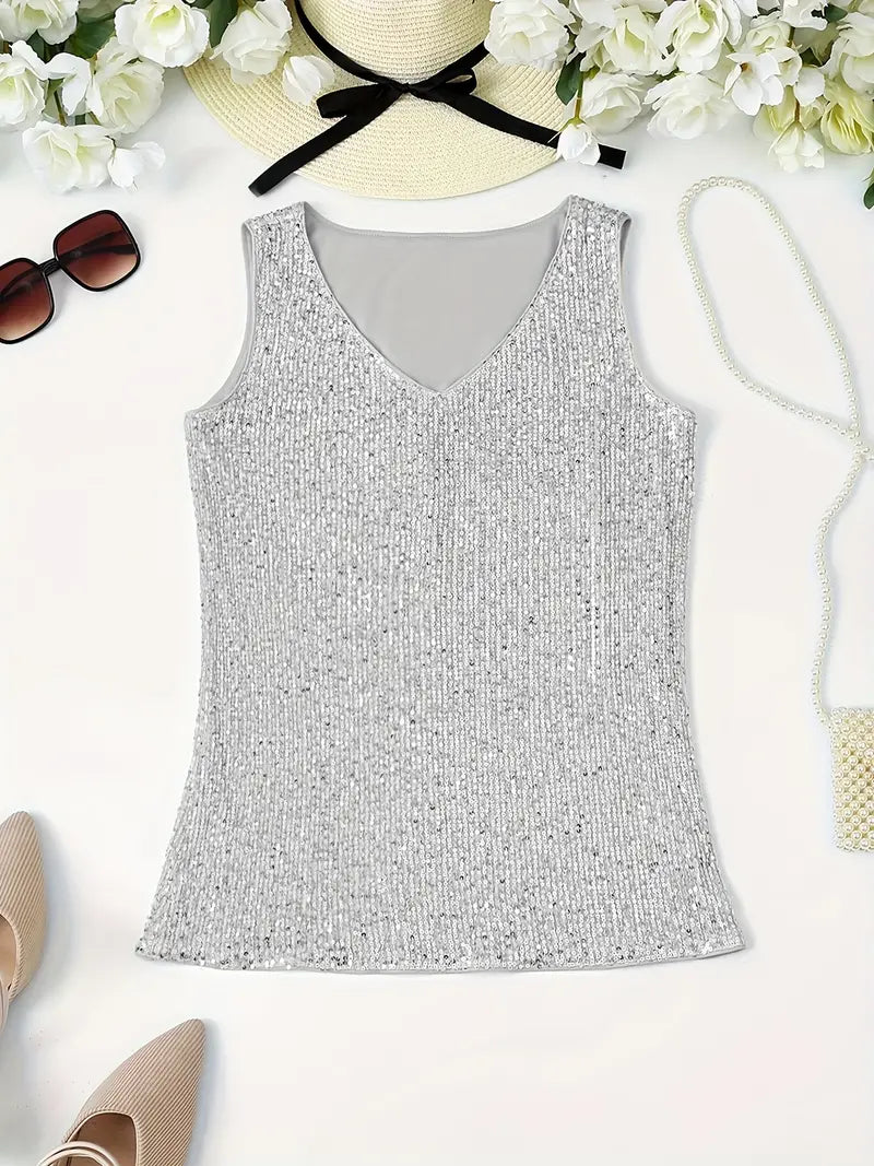 "Mouwloze top met V-hals, pailletten, elegante uitstraling, lichte stof; perfect voor zomer en avondjes uit."