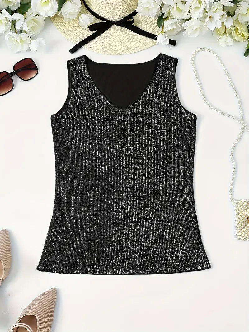 "Mouwloze top met V-hals, pailletten, elegante uitstraling, lichte stof; perfect voor zomer en avondjes uit."