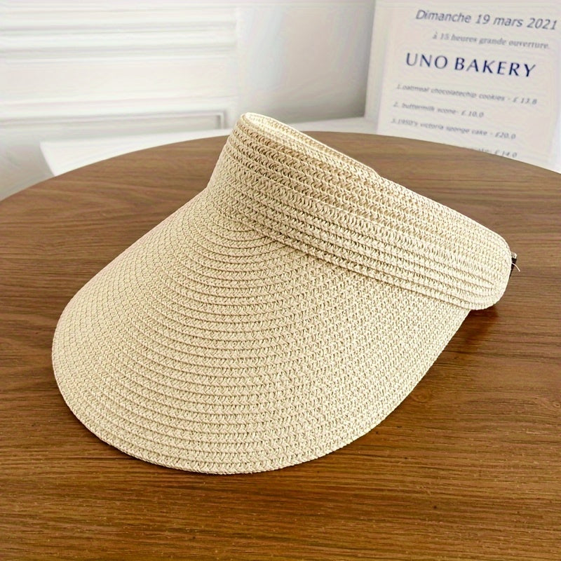 "Opvouwbare zonneklep met brede rand, beige, zwart of navy, biedt stijl en zonbescherming voor zonnige dagen."