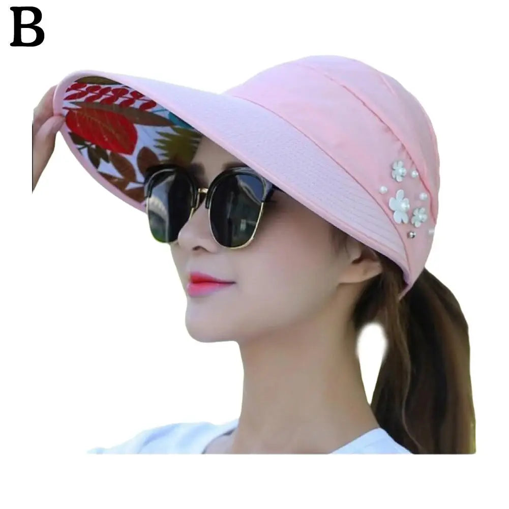 "Stijlvolle anti-UV strandhoed dames, brede rand, opvouwbaar, lichtgewicht polyester, effectieve zonbescherming."