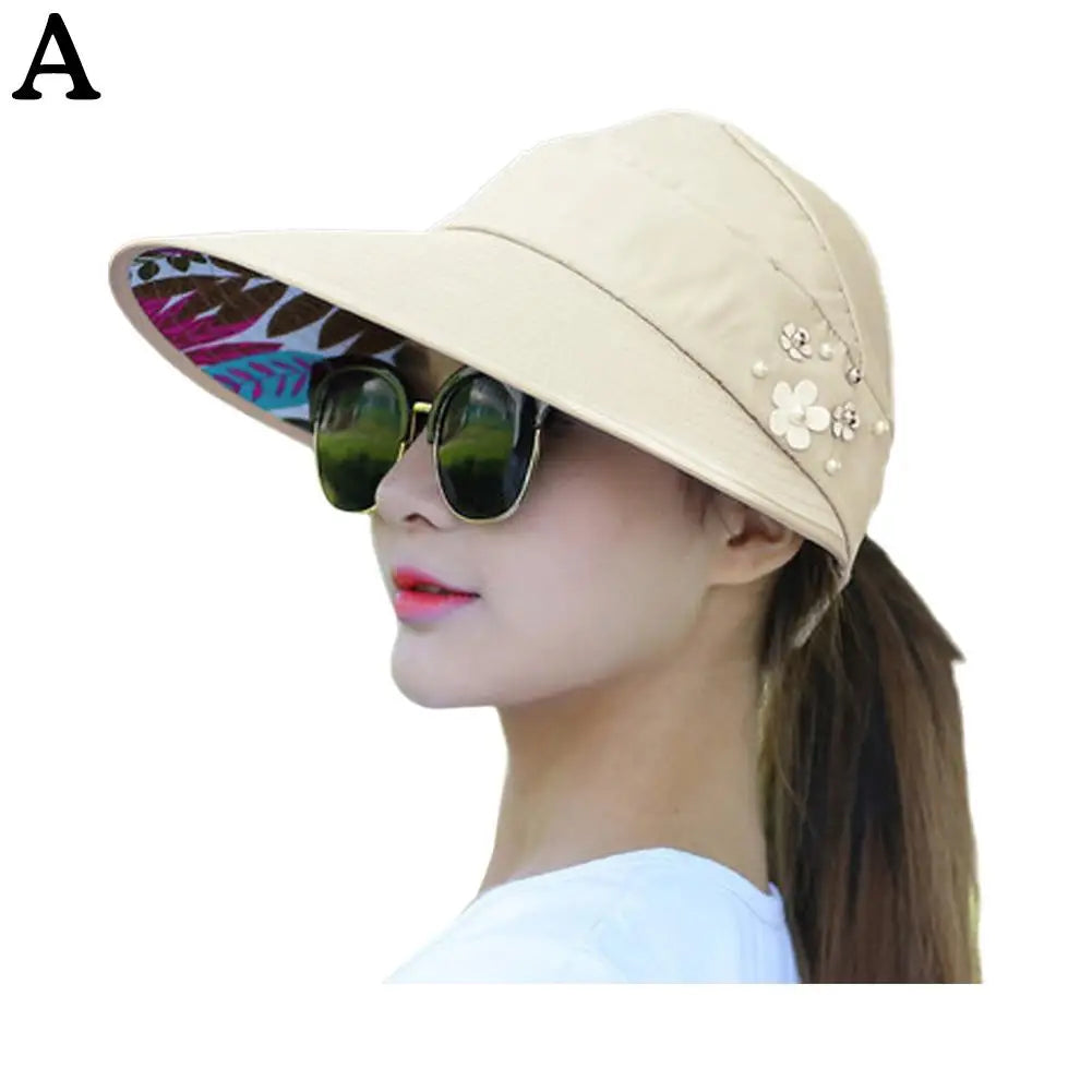 "Stijlvolle anti-UV strandhoed dames, brede rand, opvouwbaar, lichtgewicht polyester, effectieve zonbescherming."