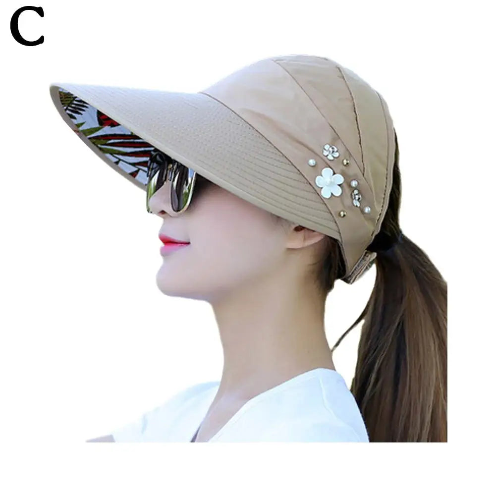 "Stijlvolle anti-UV strandhoed dames, brede rand, opvouwbaar, lichtgewicht polyester, effectieve zonbescherming."