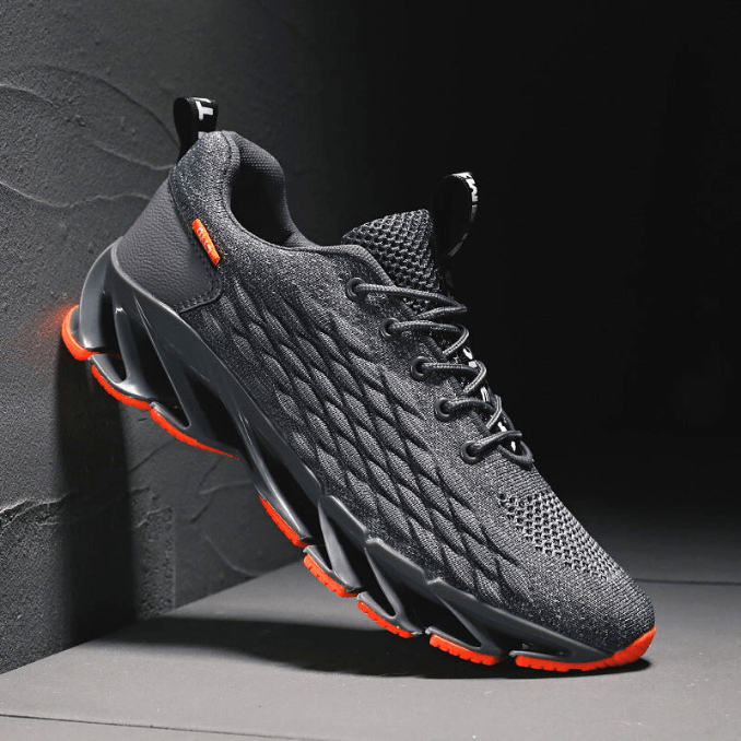 "Stijlvolle heren loopschoenen in grijs, rood, wit, zwart. Comfortabel, ademend en ideaal voor sport en dagelijks gebruik."