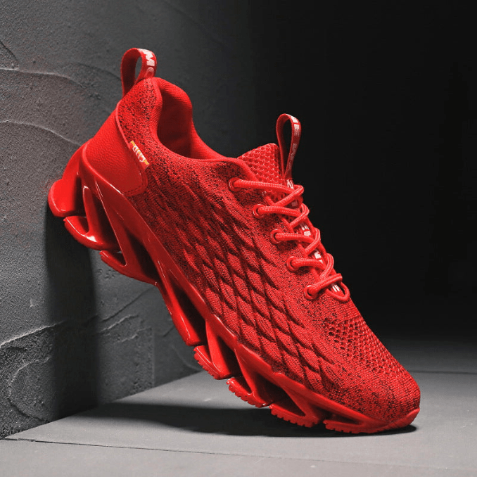 "Stijlvolle heren loopschoenen in grijs, rood, wit, zwart. Comfortabel, ademend en ideaal voor sport en dagelijks gebruik."