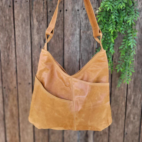 "Stijlvolle Vayenne leren tas met luxe afwerking en ruim interieur, ideaal voor elke gelegenheid en outfit, echt leer."