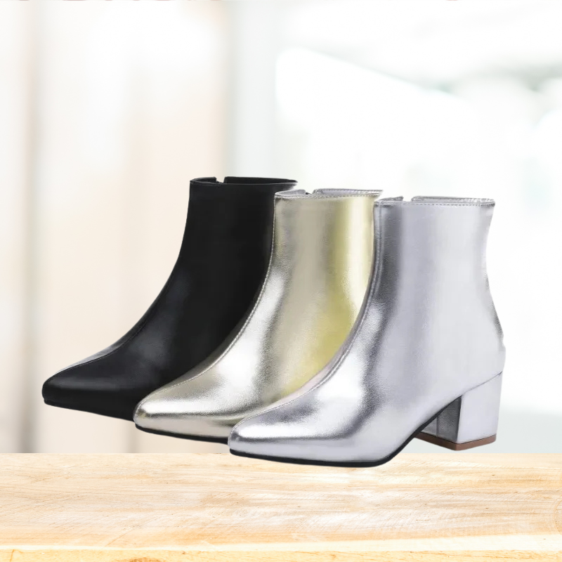"Zilveren dames enkellaarsjes met glanzende metallic afwerking, enkelhoogte, geschikt voor casual en elegante outfits."