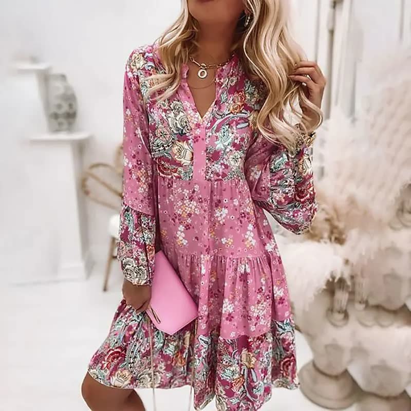 Boho zomerjurk dames met kleurrijke print, V-hals, flairmouwen en midi lengte, ideaal voor zomerse gelegenheden.