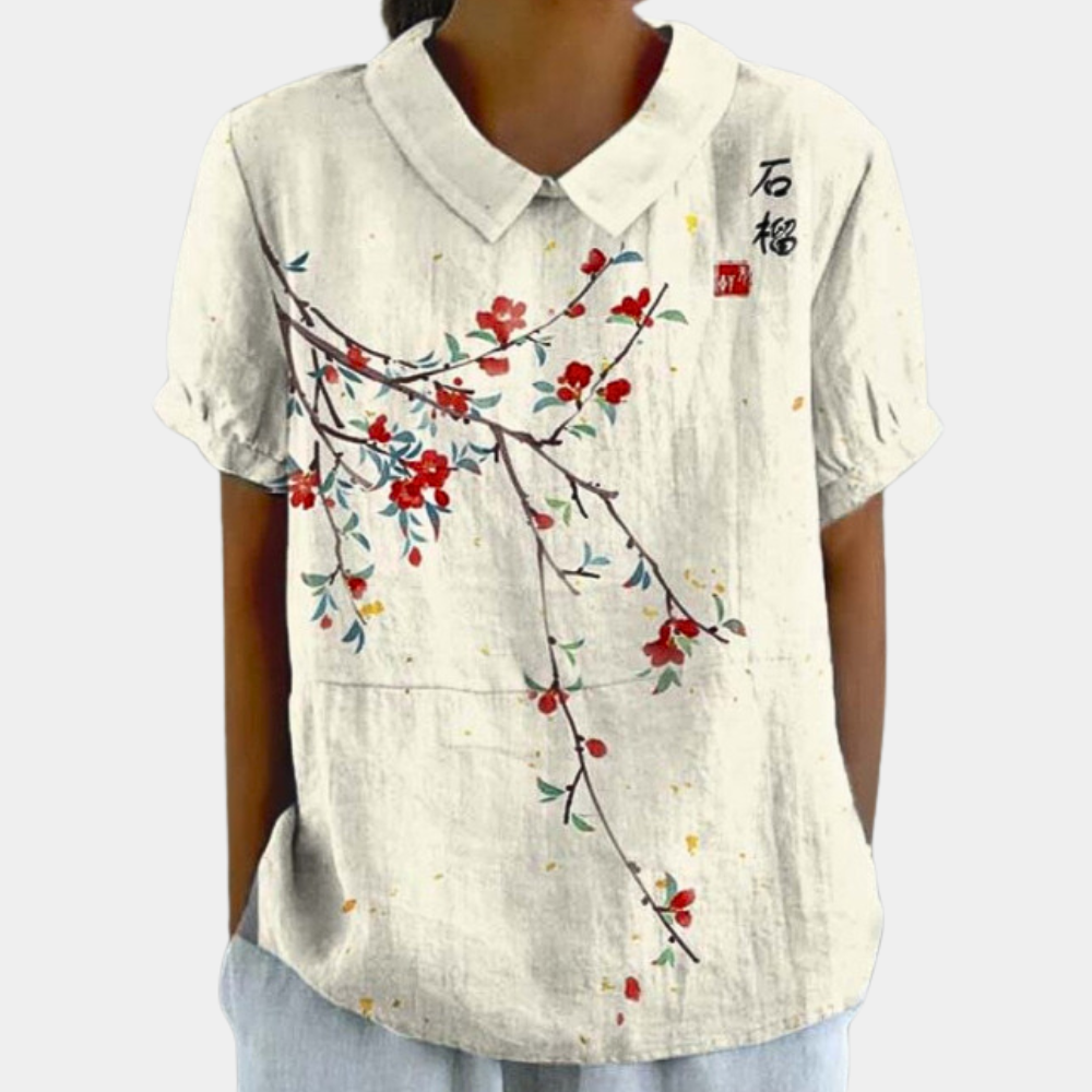 Casual damesblouse met kleurrijk bloemenpatroon, ronde kraag en korte mouwen, ideaal voor zomerse stijl.