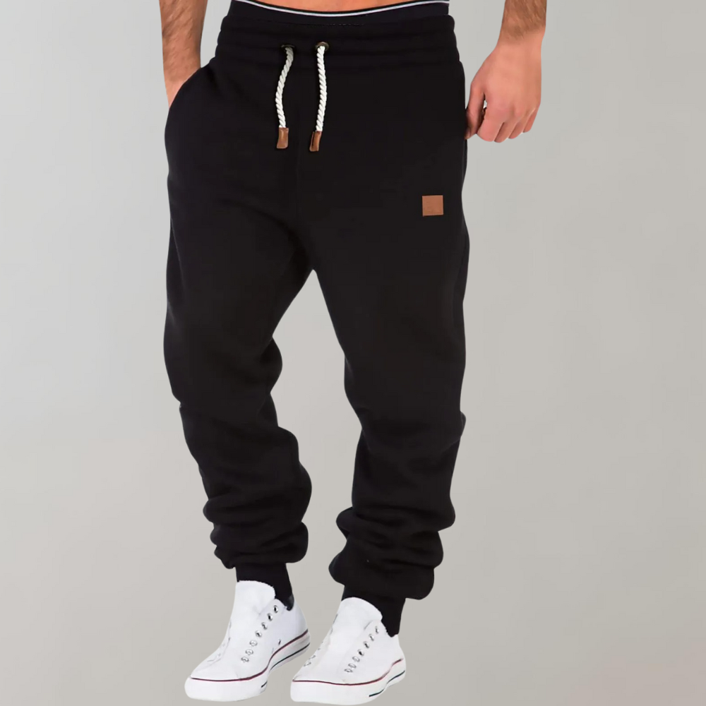 "Comfortabele heren joggingbroek, zacht materiaal, elastische tailleband, casual stijl, perfect voor thuis en uitjes."