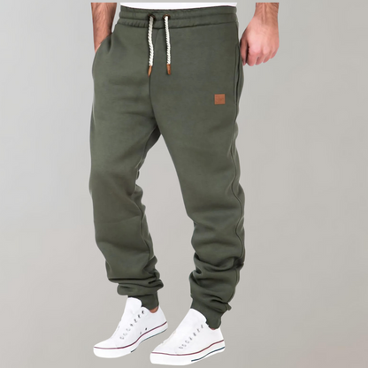 "Comfortabele heren joggingbroek, zacht materiaal, elastische tailleband, casual stijl, perfect voor thuis en uitjes."