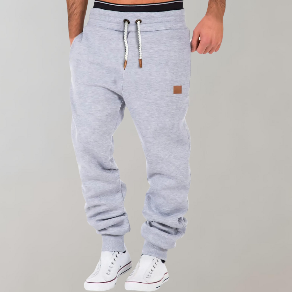 "Comfortabele heren joggingbroek, zacht materiaal, elastische tailleband, casual stijl, perfect voor thuis en uitjes."