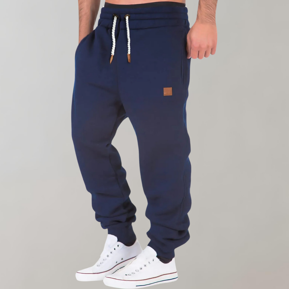 "Comfortabele heren joggingbroek, zacht materiaal, elastische tailleband, casual stijl, perfect voor thuis en uitjes."