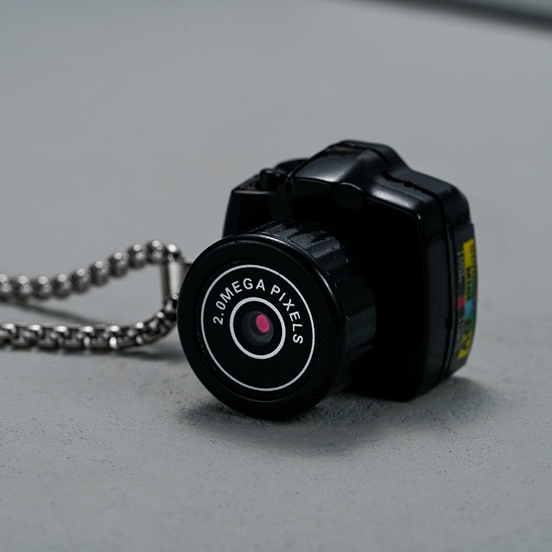 "Compacte HD mini videocamera, draagbaar ontwerp met schokbestendige behuizing, ideaal voor scherpe 1080HD opnamen."