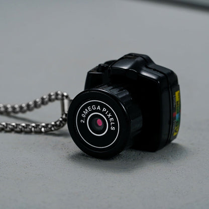 "Compacte HD mini videocamera, draagbaar ontwerp met schokbestendige behuizing, ideaal voor scherpe 1080HD opnamen."